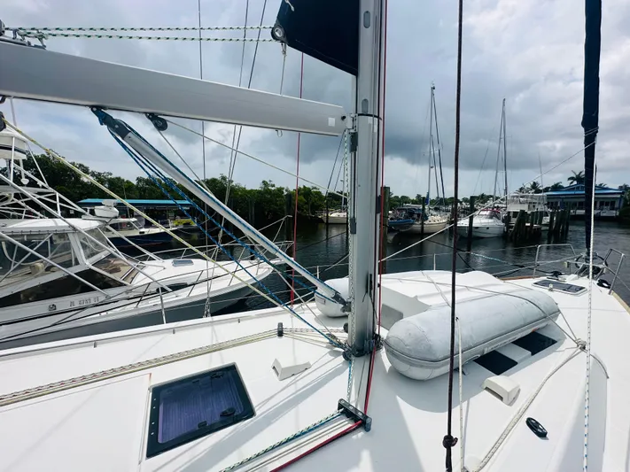 “imagine That” Yacht Photos Pics Beneteau Oceanis 45 sailboat deck, 2015 model, docked with other boats in a marina.