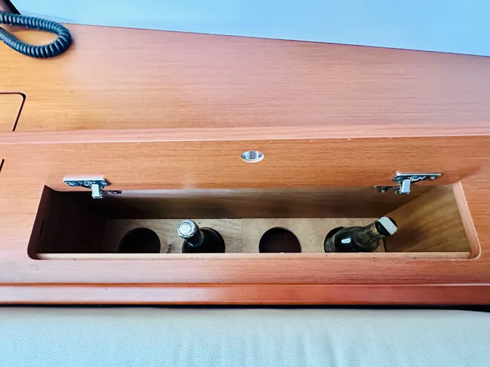 “imagine That” Yacht Photos Pics Wooden storage compartment with bottles on a 2015 Beneteau Oceanis 45 yacht.