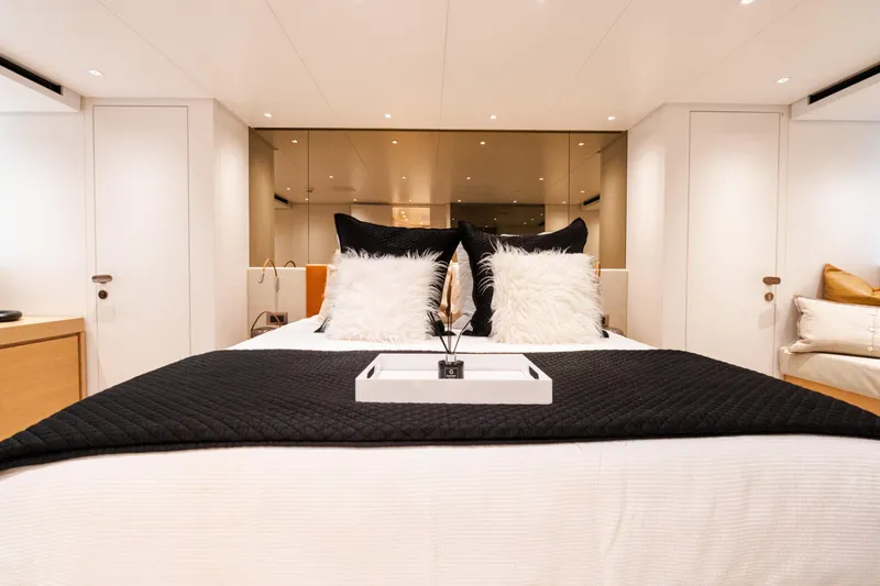 Gatsby Yacht Photos Pics Luxurious bedroom interior on 2021 Sanlorenzo SL96 yacht, featuring elegant bedding and modern decor.
