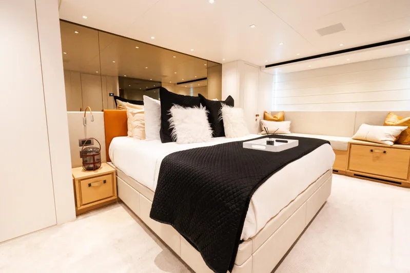 Gatsby Yacht Photos Pics Luxurious bedroom interior on 2021 Sanlorenzo SL96 yacht, featuring elegant decor and plush bedding.