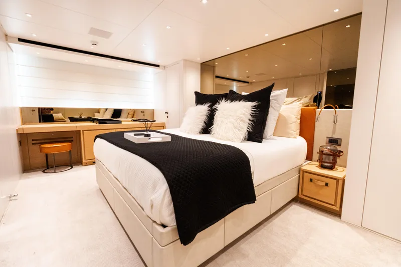 Gatsby Yacht Photos Pics Luxurious bedroom interior of 2021 Sanlorenzo SL96 yacht with elegant decor and modern furnishings.