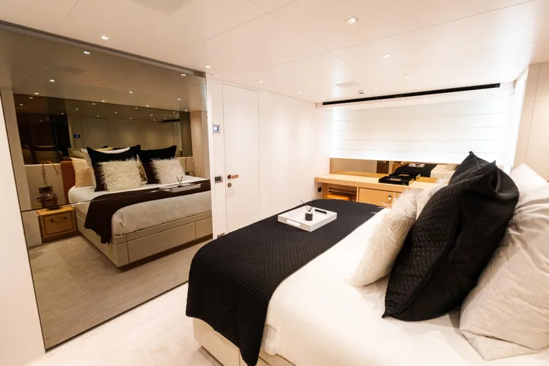 Gatsby Yacht Photos Pics Luxurious bedroom interior of 2021 Sanlorenzo SL96 yacht with elegant bedding and modern decor.