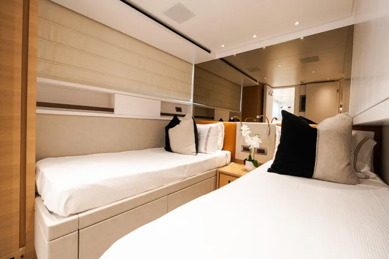 Gatsby Yacht Photos Pics Luxurious twin cabin interior on 2021 Sanlorenzo SL96 yacht, featuring elegant bedding and decor.
