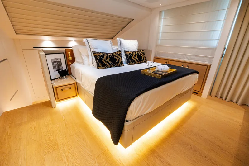 Gatsby Yacht Photos Pics Luxurious bedroom interior on 2021 Sanlorenzo SL96 yacht, featuring elegant decor and ambient lighting.