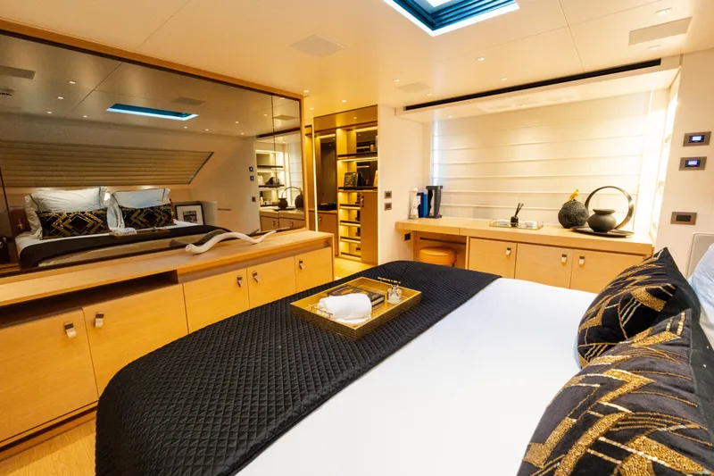 Gatsby Yacht Photos Pics Luxurious Sanlorenzo SL96 2021 yacht bedroom with elegant decor and modern furnishings.