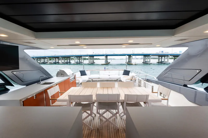 Gatsby Yacht Photos Pics Luxurious 2021 Sanlorenzo SL96 yacht deck with dining area and ocean view.