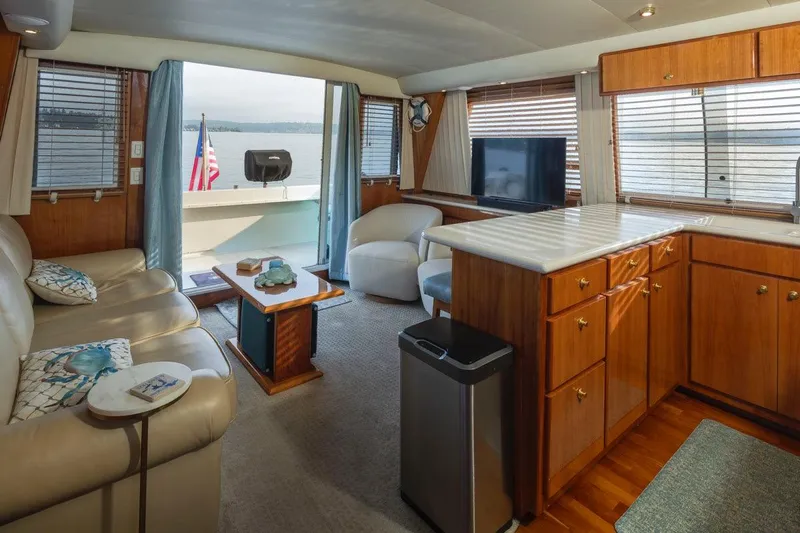 Y Knot Yacht Photos Pics Luxurious 2003 Navigator 4800 yacht interior with elegant wood cabinetry and comfortable seating.