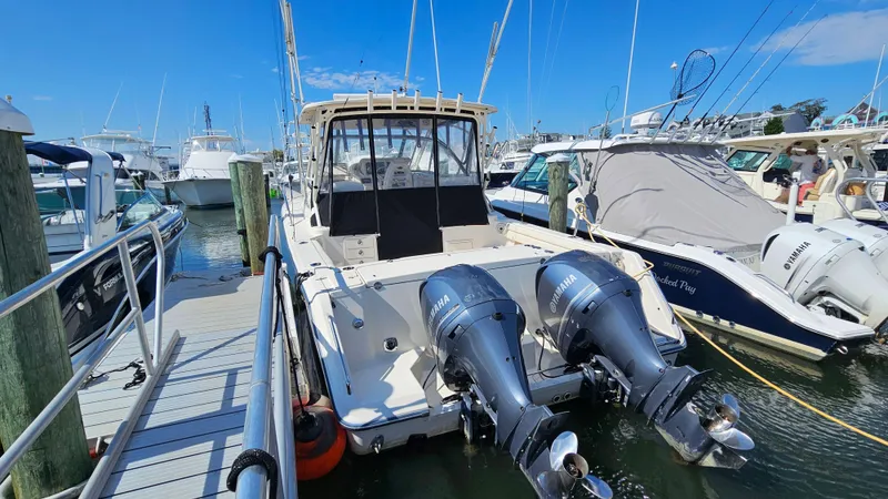  Yacht Photos Pics 2016 Grady-White Express 330 boat docked with twin outboard engines.