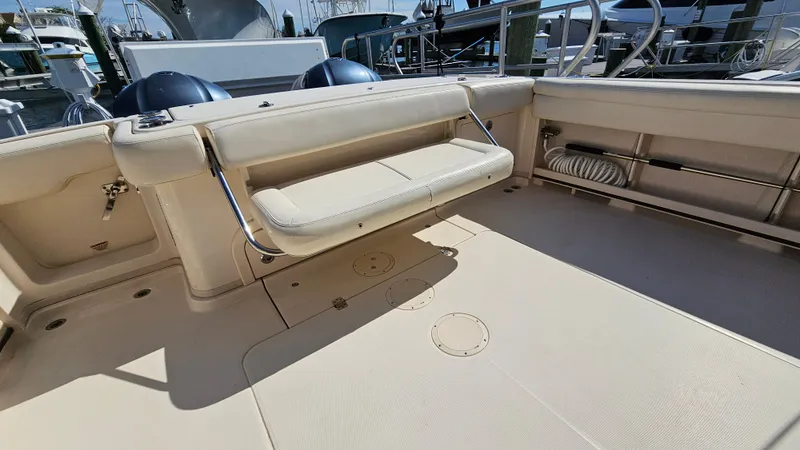  Yacht Photos Pics 2016 Grady-White Express 330 boat interior with foldable seating and spacious deck area.