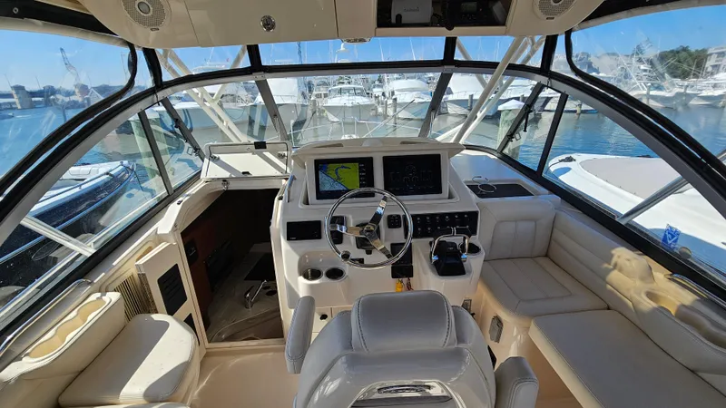  Yacht Photos Pics 2016 Grady-White Express 330 boat interior with helm, seating, and navigation equipment.