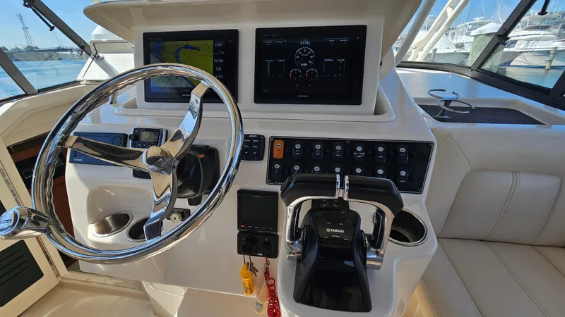  Yacht Photos Pics 2016 Grady-White Express 330 helm with steering wheel and control panel.
