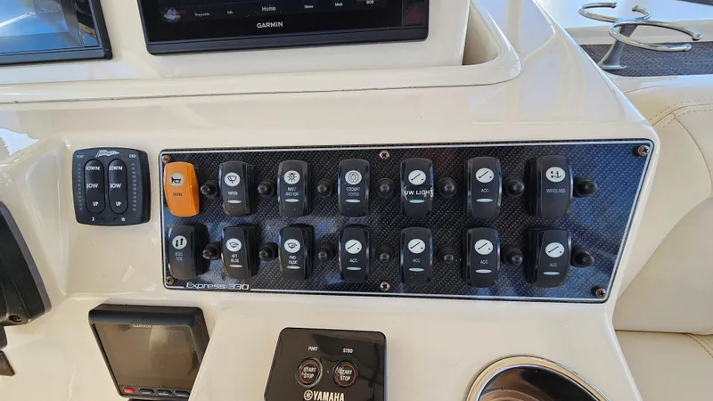  Yacht Photos Pics Control panel of 2016 Grady-White Express 330 boat with various switches and displays.