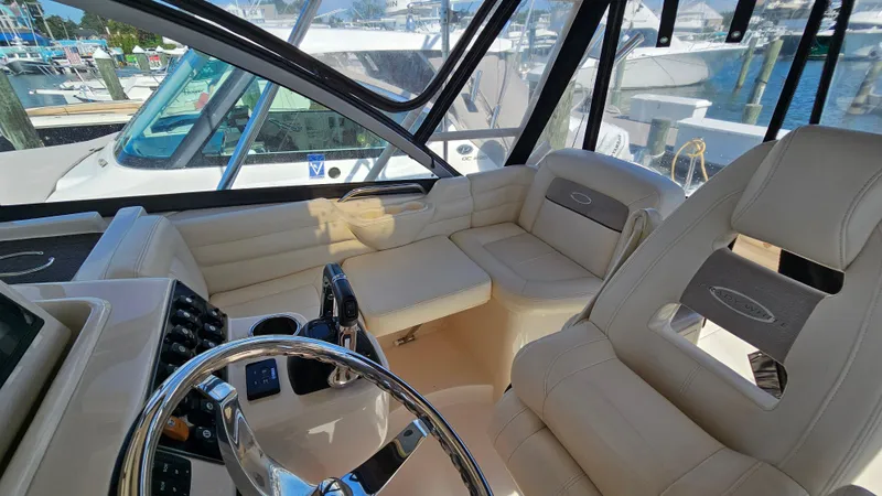  Yacht Photos Pics 2016 Grady-White Express 330 boat interior with plush seating and modern helm.