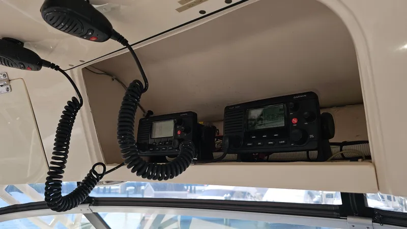  Yacht Photos Pics 2016 Grady-White Express 330 boat communication equipment with mounted radios and microphones.