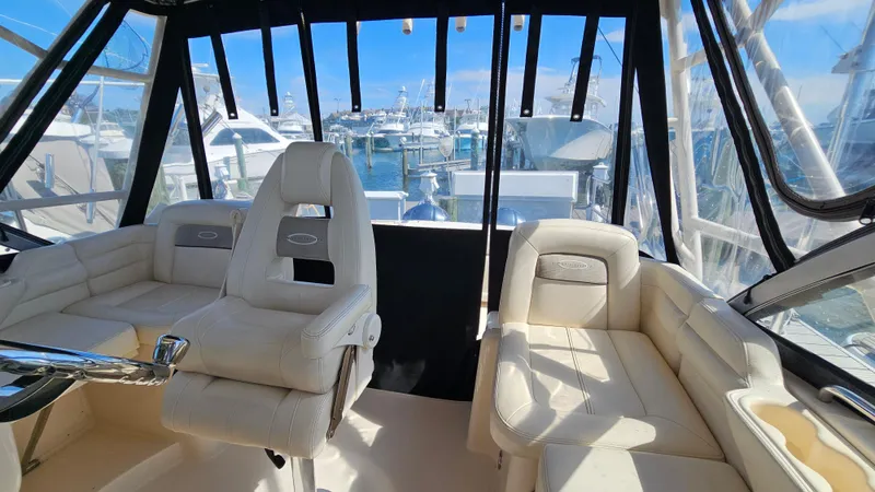  Yacht Photos Pics 2016 Grady-White Express 330 boat interior with plush seating and marina view.