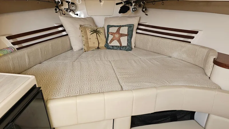  Yacht Photos Pics 2016 Grady-White Express 330 cabin interior with cozy bedding and decorative pillows.