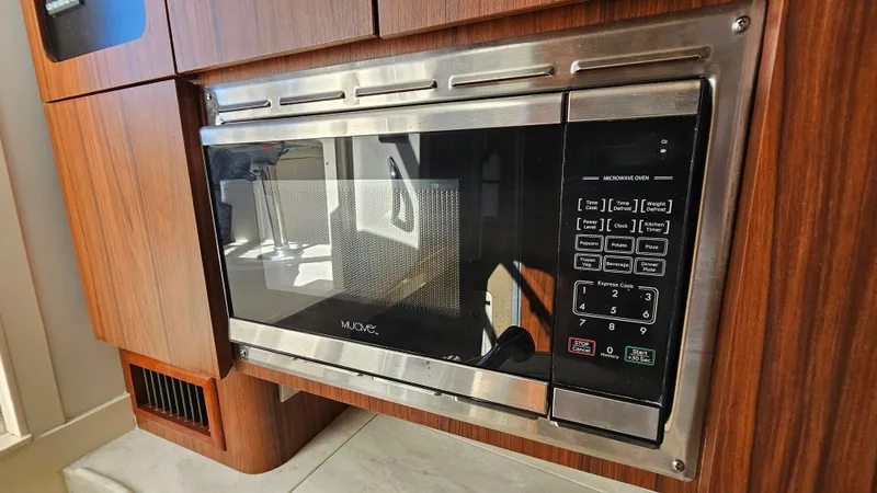  Yacht Photos Pics Built-in microwave in 2016 Grady-White Express 330 boat kitchen.
