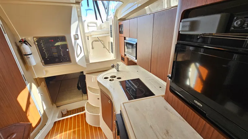  Yacht Photos Pics Interior of 2016 Grady-White Express 330 boat with modern kitchen amenities.