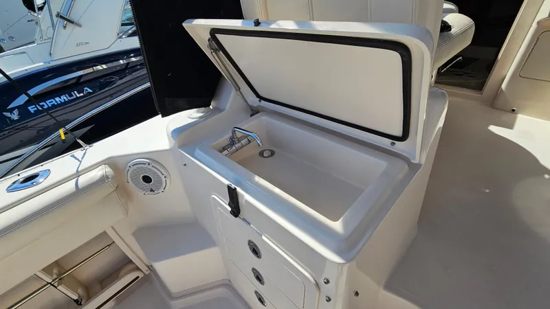  Yacht Photos Pics 2016 Grady-White Express 330 boat interior with open storage compartment.