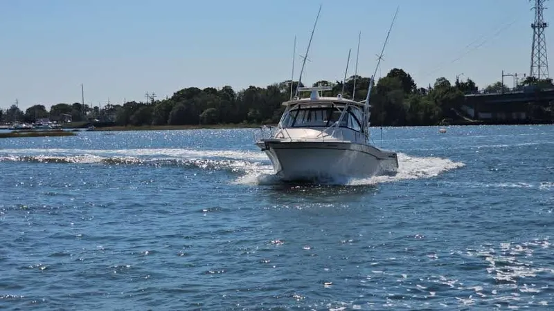  Yacht Photos Pics 2016 Grady-White Express 330 boat cruising on a sunny day.