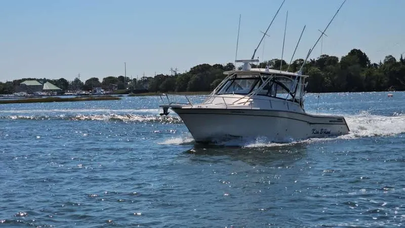  Yacht Photos Pics 2016 Grady-White Express 330 boat cruising on a sunny day in open water.