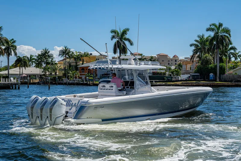  Yacht Photos Pics 2019 Intrepid 400 boat cruising on a sunny day with palm trees in the background.
