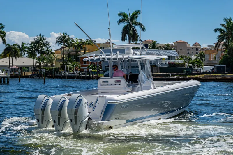 Yacht Photos Pics 2019 Intrepid 400 boat cruising on a sunny day with palm trees in the background.