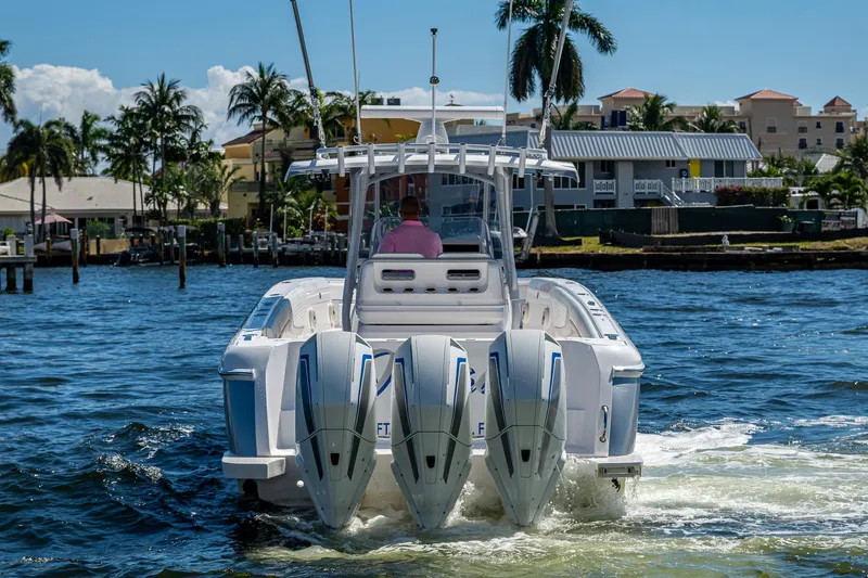  Yacht Photos Pics 2019 Intrepid 400 boat with triple engines cruising on a sunny day.
