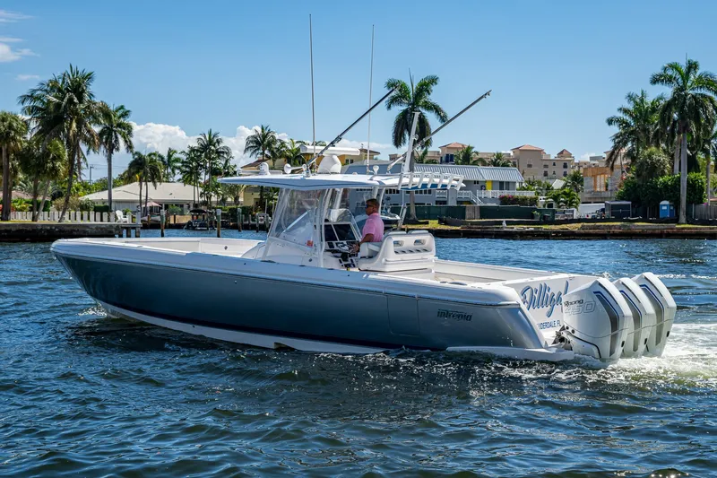  Yacht Photos Pics 2019 Intrepid 400 boat cruising on a sunny day with palm trees in the background.
