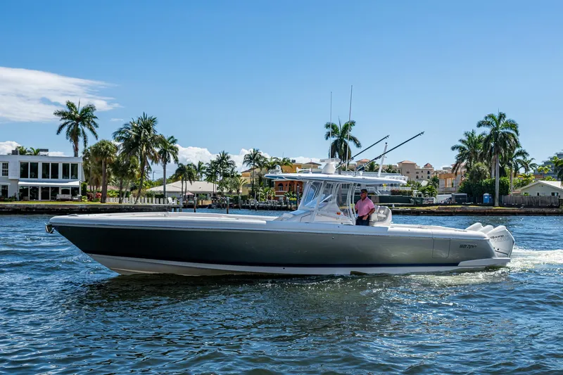  Yacht Photos Pics 2019 Intrepid 400 boat cruising on a sunny day with palm trees in the background.