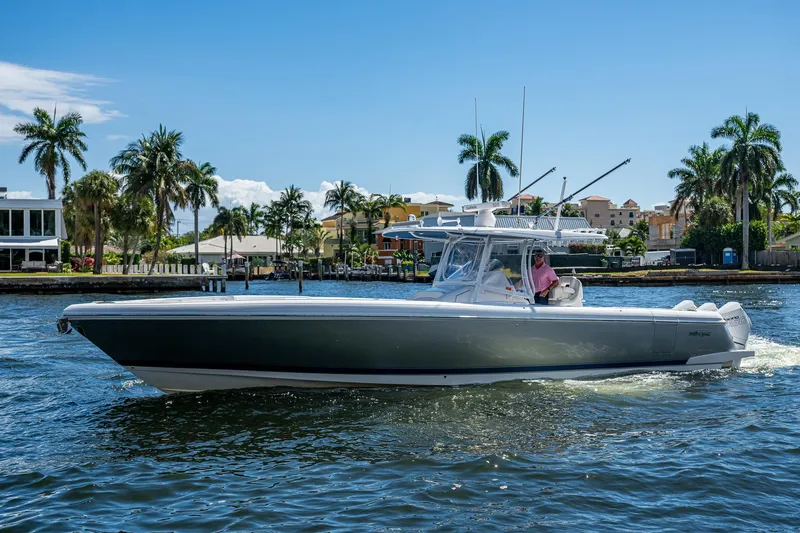  Yacht Photos Pics 2019 Intrepid 400 boat cruising on a sunny day with palm trees in the background.
