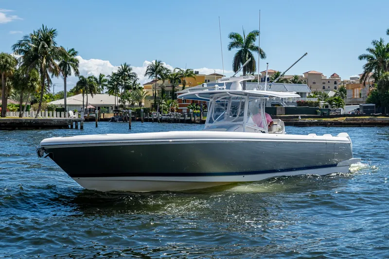  Yacht Photos Pics 2019 Intrepid 400 boat cruising on a sunny day with palm trees in the background.