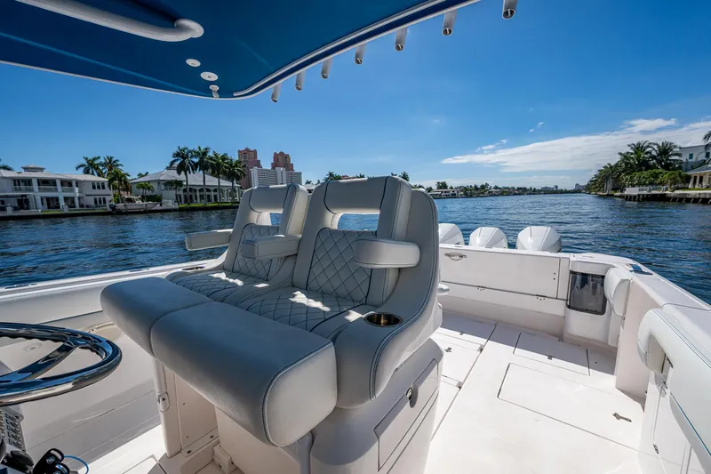  Yacht Photos Pics Luxury seating on a 2019 Intrepid 400 boat, cruising on a scenic waterway.