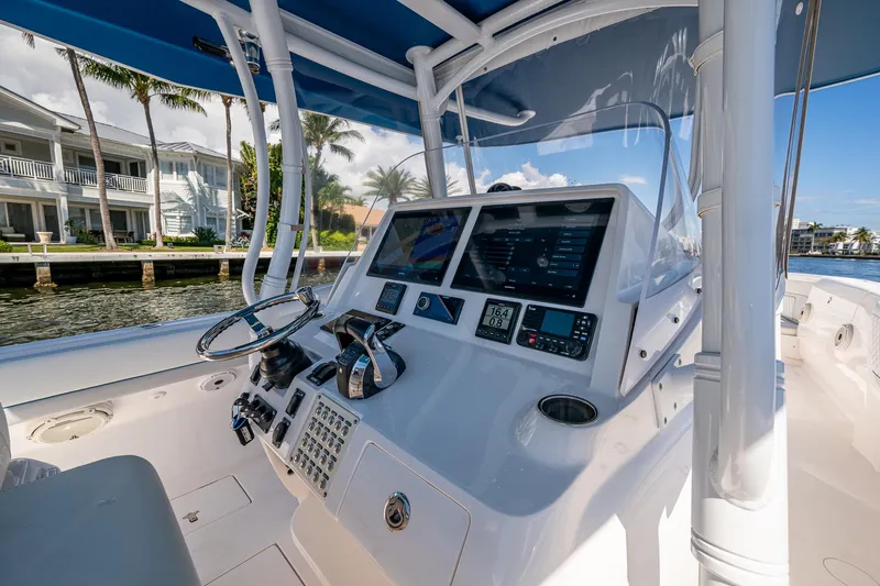  Yacht Photos Pics 2019 Intrepid 400 boat cockpit with modern navigation equipment and waterfront view.