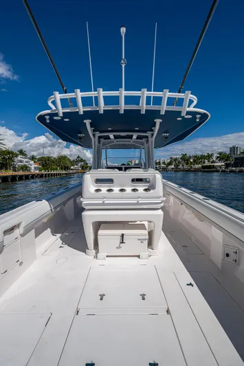  Yacht Photos Pics 2019 Intrepid 400 boat with sleek design, spacious deck, and modern console on a sunny day.