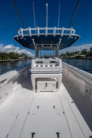  Yacht Photos Pics 2019 Intrepid 400 boat, spacious deck, clear blue sky, waterfront view.