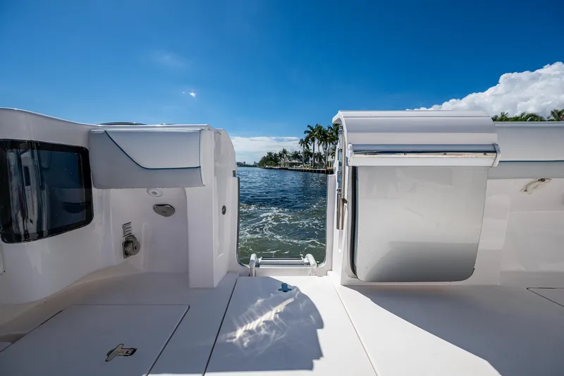  Yacht Photos Pics 2019 Intrepid 400 boat with open deck, ocean view, and clear blue sky.