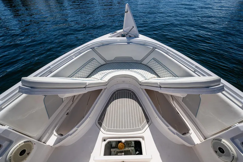 Yacht Photos Pics 2019 Intrepid 400 boat interior with open storage compartments on calm water.