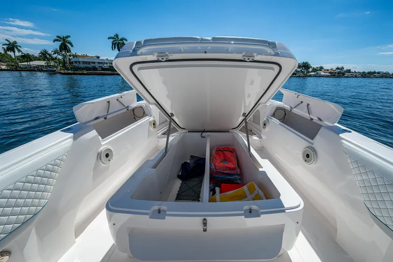  Yacht Photos Pics Open storage compartment on 2019 Intrepid 400 boat, with life jackets and gear inside.