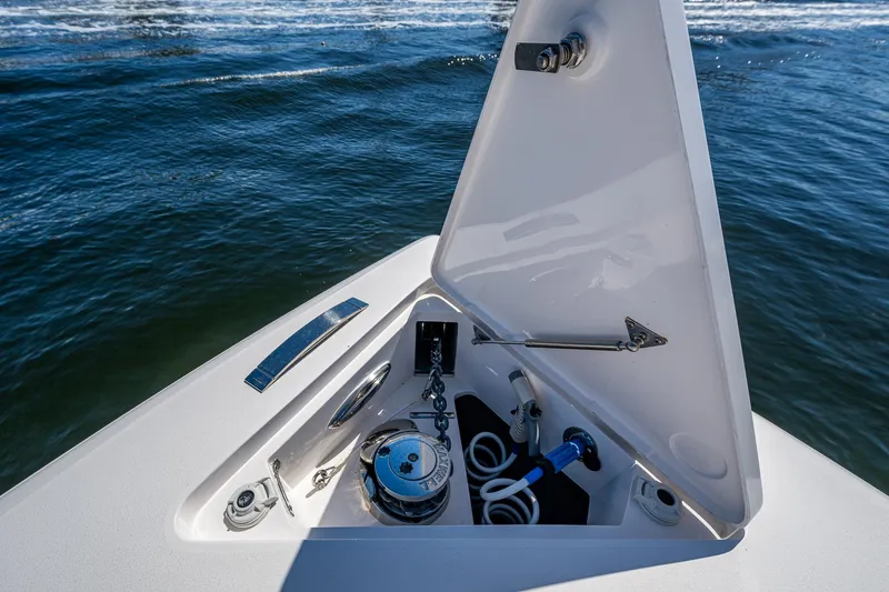  Yacht Photos Pics 2019 Intrepid 400 boat anchor compartment with open hatch on calm water.