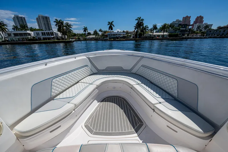  Yacht Photos Pics 2019 Intrepid 400 boat with luxurious seating, cruising on a scenic waterfront.