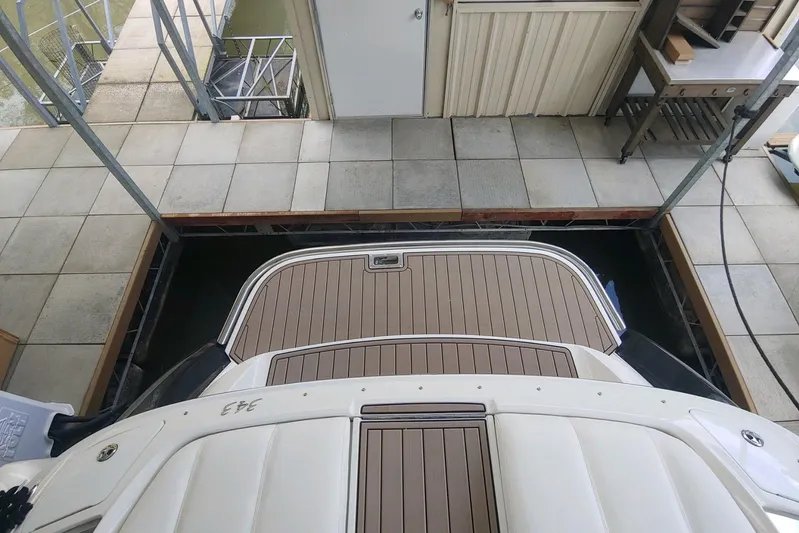  Yacht Photos Pics 2004 Cobalt 343 boat docked in a covered marina slip.