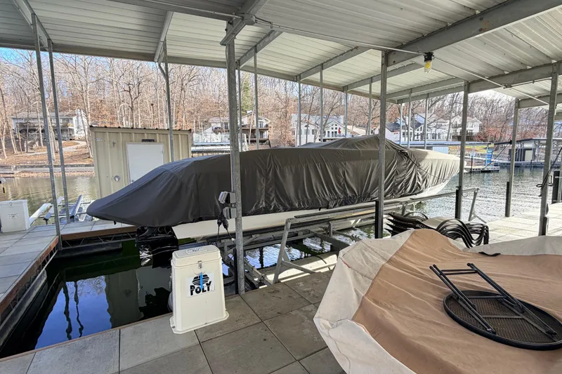  Yacht Photos Pics Covered 2004 Cobalt 343 boat docked in a sheltered marina area.