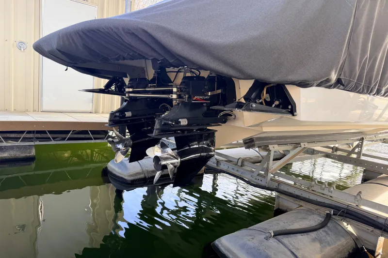  Yacht Photos Pics Covered 2004 Cobalt 343 boat with Mercury outboard engines on a lift.