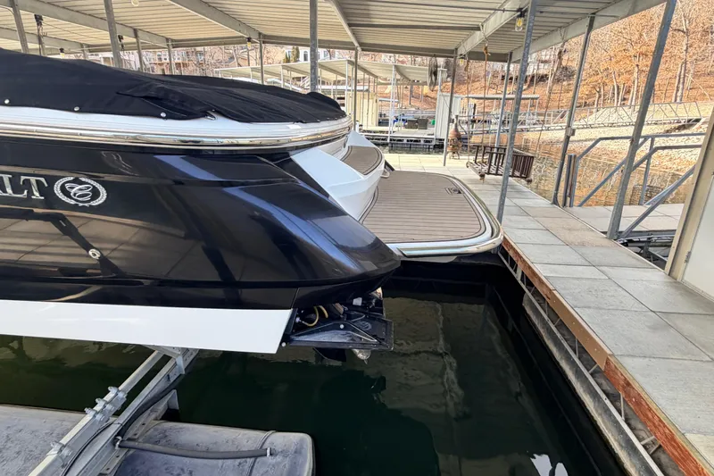  Yacht Photos Pics 2004 Cobalt 343 boat docked in a covered marina, rear view.