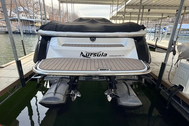  Yacht Photos Pics 2004 Cobalt 343 boat docked, rear view with covered deck and dual propellers.
