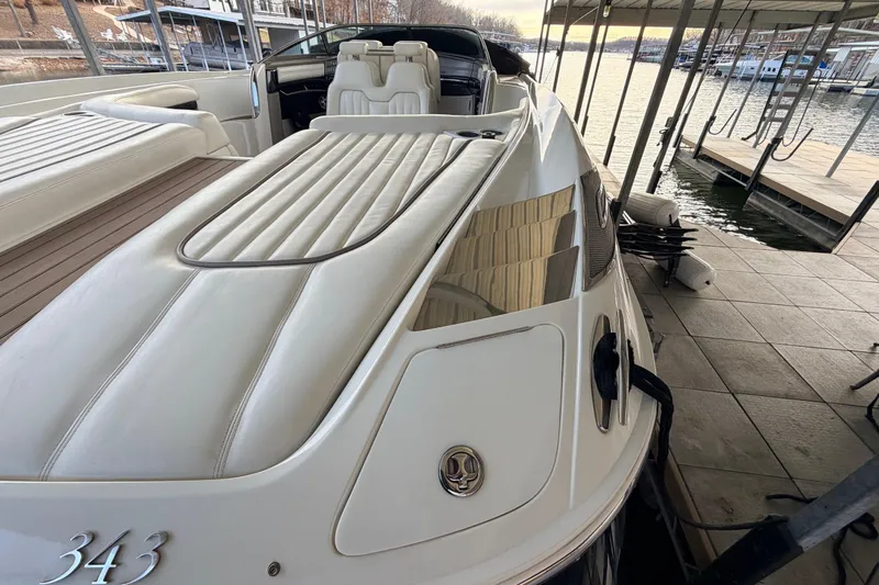  Yacht Photos Pics 2004 Cobalt 343 boat docked, featuring sleek white seating and elegant design.