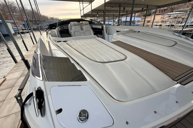  Yacht Photos Pics 2004 Cobalt 343 boat docked, featuring sleek white design and spacious seating.