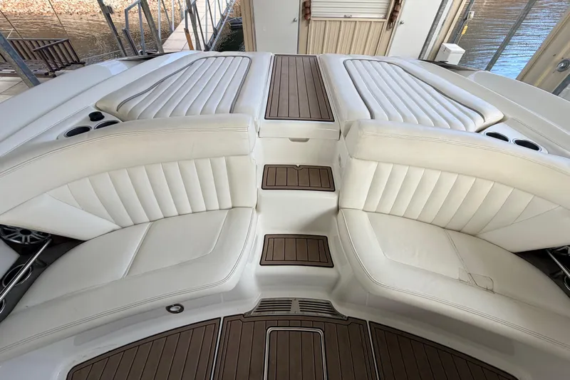  Yacht Photos Pics Luxurious 2004 Cobalt 343 boat interior with white leather seating and wood accents.