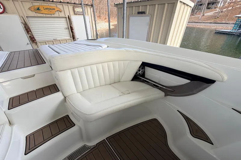  Yacht Photos Pics Luxurious seating area on a 2004 Cobalt 343 boat, featuring white upholstery and wood accents.